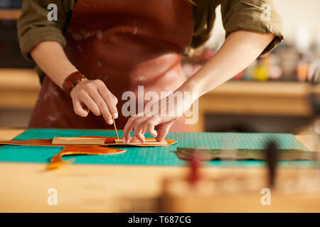 Tailor Working with Leather Closeup Stock Photo