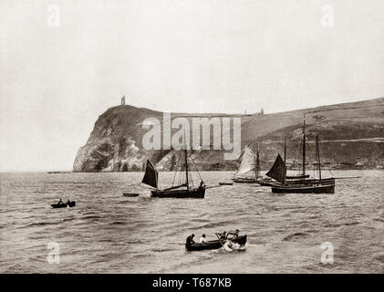 A 19th Century view of fishing boats off  Port Erin, a seaside village in the south-west of the Isle of Man, a self-governing British Crown dependency in the Irish Sea between Great Britain and Ireland. Stock Photo