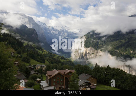 The spectacular Lauterbrunnen valley in early morning from the station at Wengen, Bernese Oberland, Switzerland Stock Photo