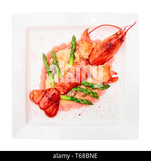 Prepared lobster on porcelain plate, isolated on white Stock Photo