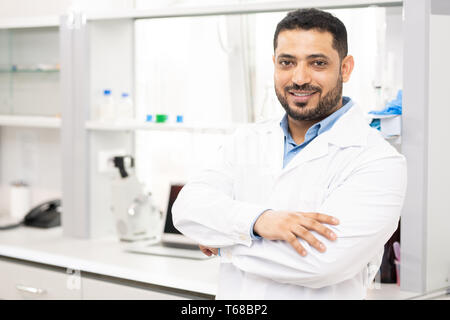 Smiling lab worker in white coat Stock Photo