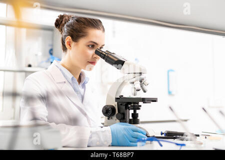 Biologist observing material at molecular level Stock Photo