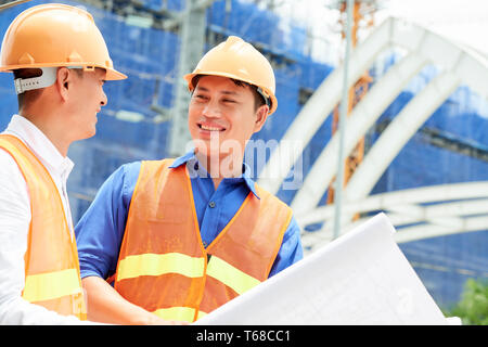 Successful business partners working on construction site Stock Photo