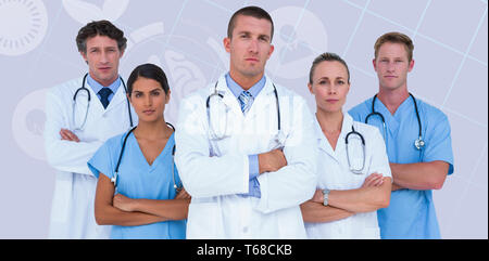 Composite image of portrait of serious doctors standing with arms crossed Stock Photo