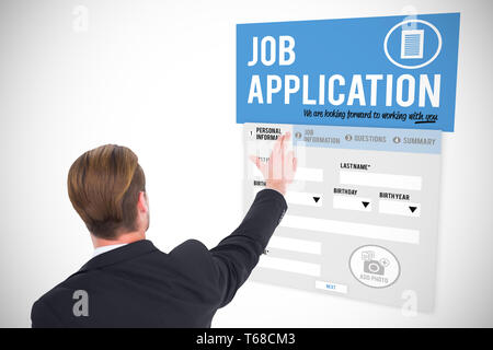 Composite image of rear view of businessman pointing with his fingers Stock Photo