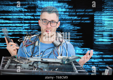 Composite image of confused it professional with cables and phone in front of open cpu Stock Photo
