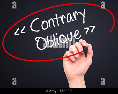 Man Hand writing Contrary - Oblique with black marker on visual screen Stock Photo