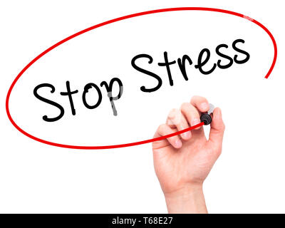 Man Hand writing Stop Stress with black marker on visual screen Stock Photo