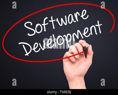 Man Hand writing Software Development with black marker on visual screen Stock Photo