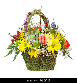 Flowers bouquet arrangement centerpiece in wicker basket. Stock Photo