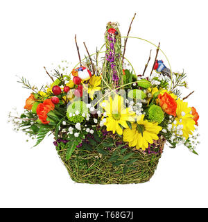 Flowers bouquet arrangement centerpiece in wicker basket. Stock Photo