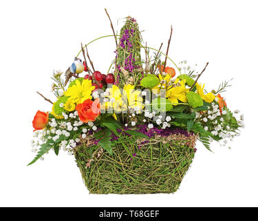 Flowers bouquet arrangement centerpiece in wicker basket. Stock Photo