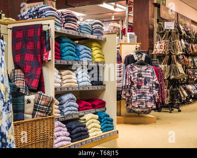 Colourful displays of mens ware on display at a town centre department store Stock Photo