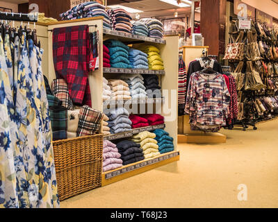 Colourful displays of mens ware on display at a town centre department store Stock Photo