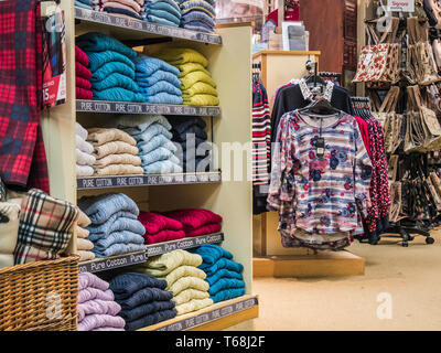 Colourful displays of mens ware on display at a town centre department store Stock Photo