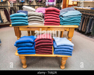 Colourful displays of mens ware on display at a town centre department store Stock Photo