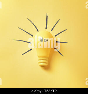 Light bulb as symbol of new idea on color background Stock Photo