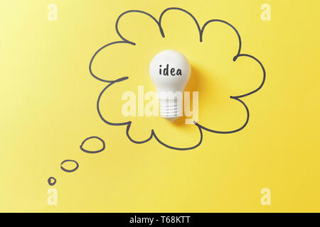 Light bulb as symbol of new idea on color background Stock Photo