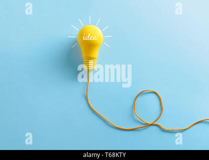 Light bulb as symbol of new idea on color background Stock Photo