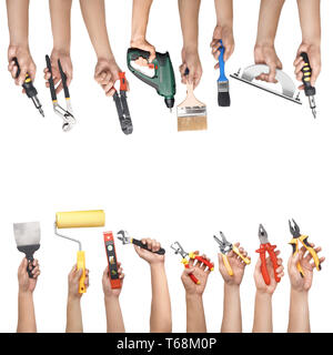 Male hands with different repair tools on white background Stock Photo