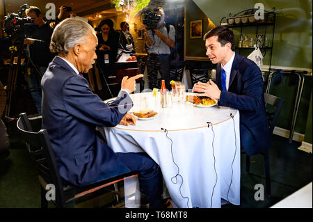 Mayor Pete Buttigieg (D) of South Bend, Indiana and Rev. Al Sharpton are seen at Sylvia's Restaurant as they eat lunch together in Harlem, New York City. Stock Photo