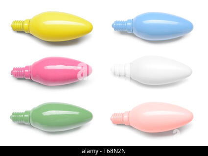 Different painted light bulbs on white background Stock Photo
