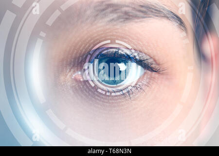 Female hacker with iris scanning, closeup. Concept of digital crime Stock Photo