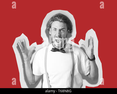 Portrait of handsome aggressive man on color background Stock Photo