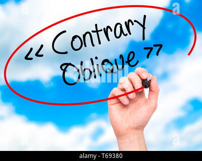 Man Hand writing Contrary - Oblique with black marker on visual screen Stock Photo