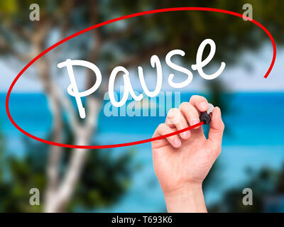 Man Hand writing Pause with black marker on visual screen Stock Photo