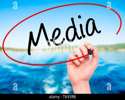 Man Hand writing Media with black marker on visual screen. Isolated on ...