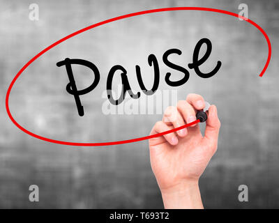 Man Hand writing Pause with black marker on visual screen Stock Photo