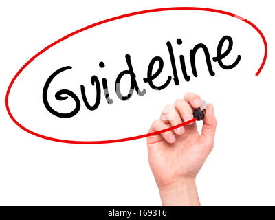 Man Hand writing Guideline with black marker on visual screen Stock Photo