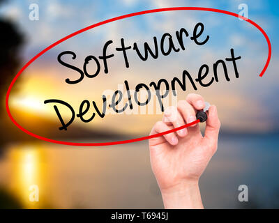 Man Hand writing Software Development with black marker on visual screen Stock Photo