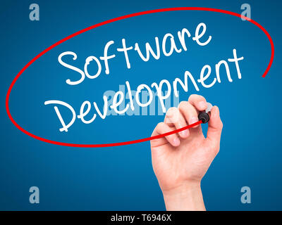 Man Hand writing Software Development with black marker on visual screen Stock Photo