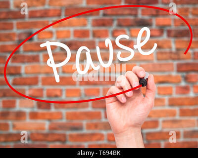 Man Hand writing Pause with black marker on visual screen Stock Photo