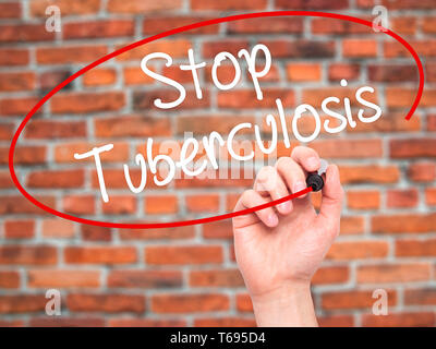 Man Hand writing Stop Tuberculosis with black marker on visual screen. Stock Photo