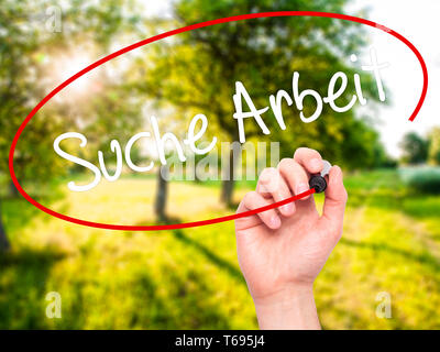 Man Hand writing Suche Arbeit (Job Search in German)  with black marker on visual screen. Stock Photo