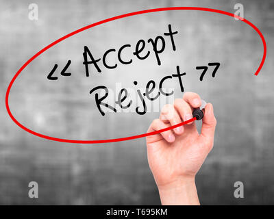 Man Hand writing Accept - Reject  with black marker on visual screen. Stock Photo