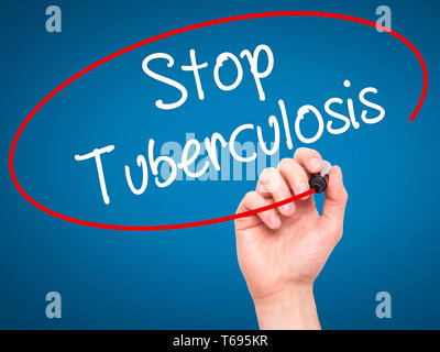 Man Hand writing Stop Tuberculosis with black marker on visual screen. Stock Photo