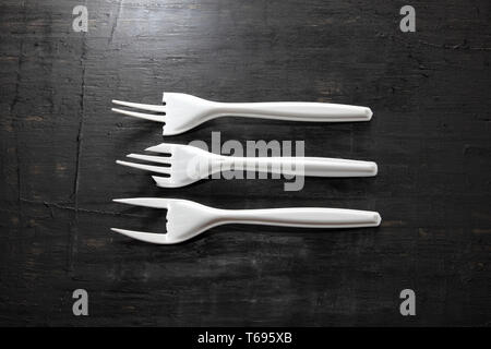 Plastic Forks on Wooden Background Stock Photo