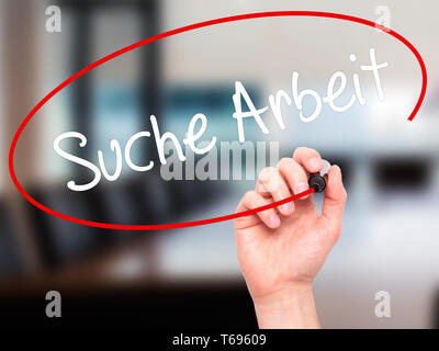 Man Hand writing Suche Arbeit (Job Search in German)  with black marker on visual screen. Stock Photo