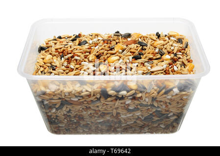 Box of Bird Seeds on White Background Stock Photo