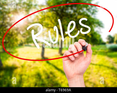 Man Hand writing Rules with black marker on visual screen Stock Photo ...
