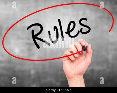 Man Hand writing Rules with black marker on visual screen Stock Photo ...