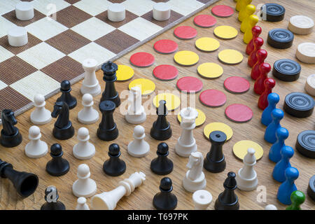 Different objects of boards games on a wooden surface Stock Photo