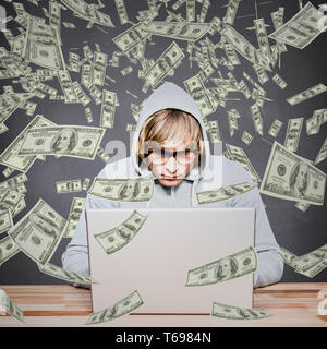 Composite image of  man in hood jacket hacking a laptop Stock Photo