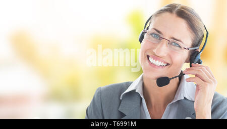 Composite image of portrait of a call center executive wearing headset Stock Photo