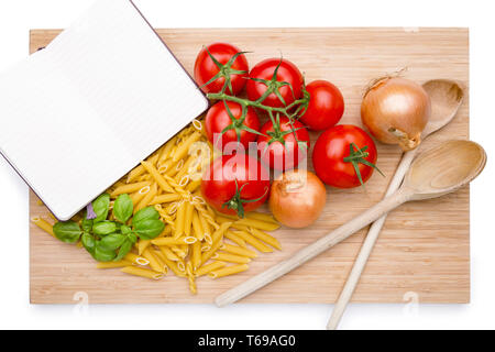 Groceries and noodles on a wooden cutting board Stock Photo