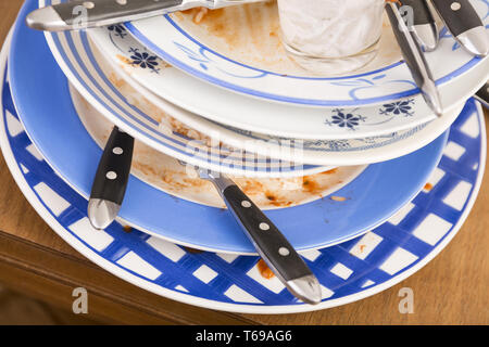 Table with several dirty dishes arranged on it Stock Photo